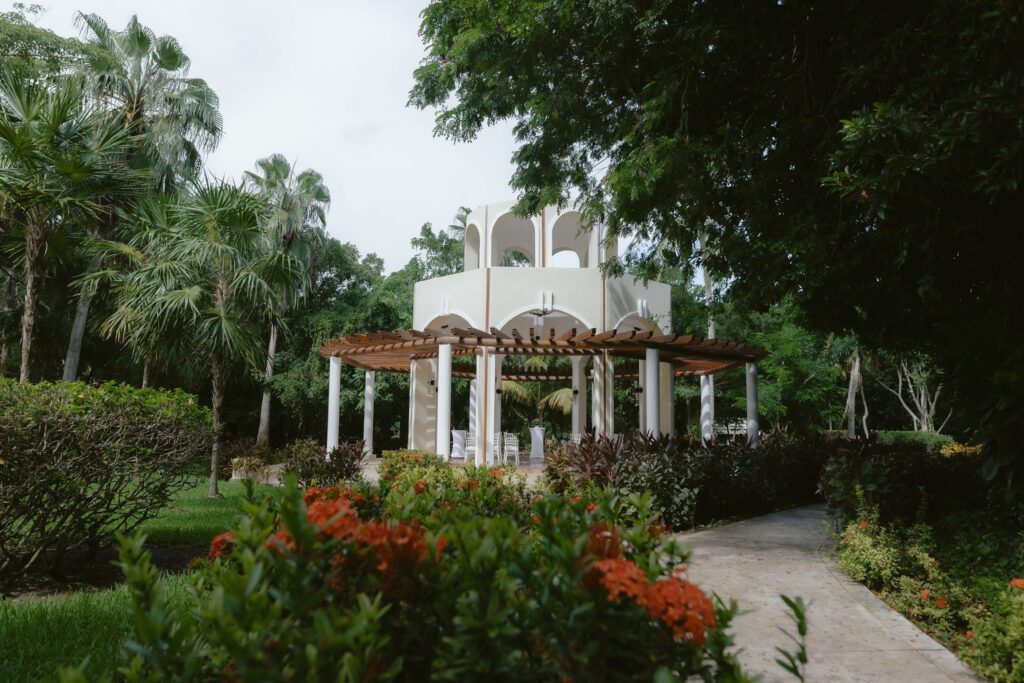 wedding gazebo at Valentin Imperial Riviera Maya surrounded by palm trees