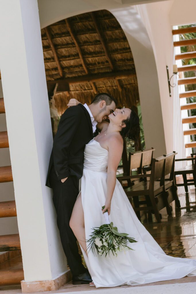 Bride twirling in front of the resort’s cream-toned arches.