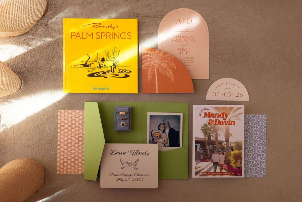 Elegant wedding invitation flat lay at The Drift Palm Springs featuring modern stationery, neutral styling, vintage-inspired details, and desert wedding aesthetics in Palm Springs.