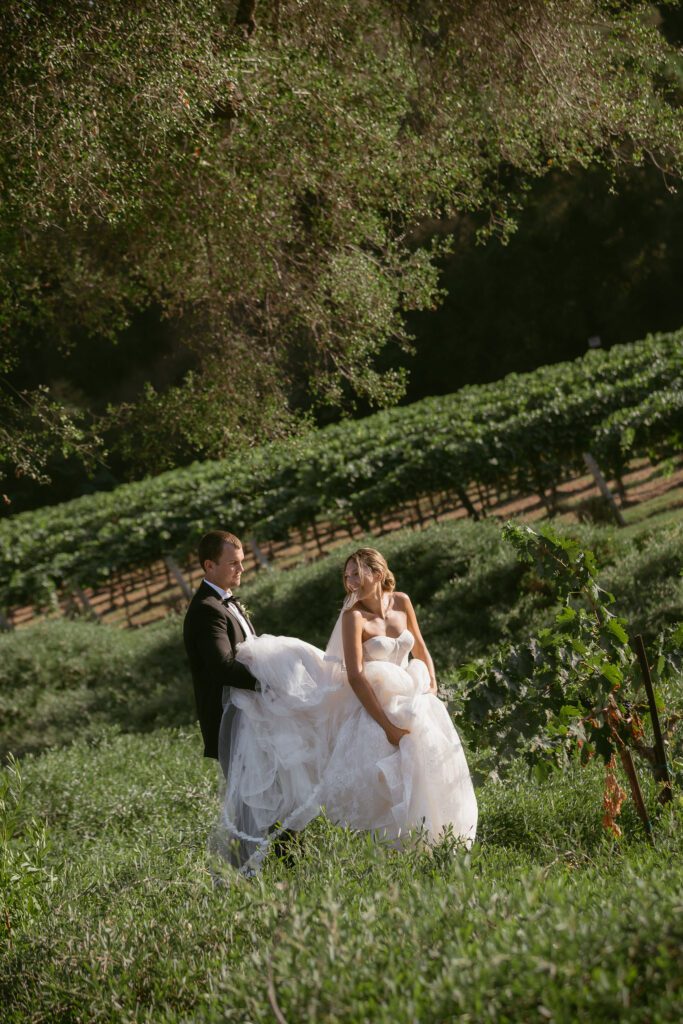 Bride and groom laughing together during wedding portraits at Monserate Winery.