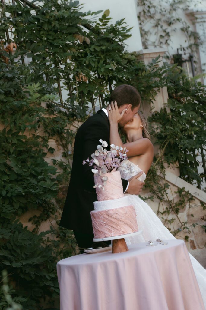 Bride and groom cutting their wedding cake during the reception at Monserate Winery.