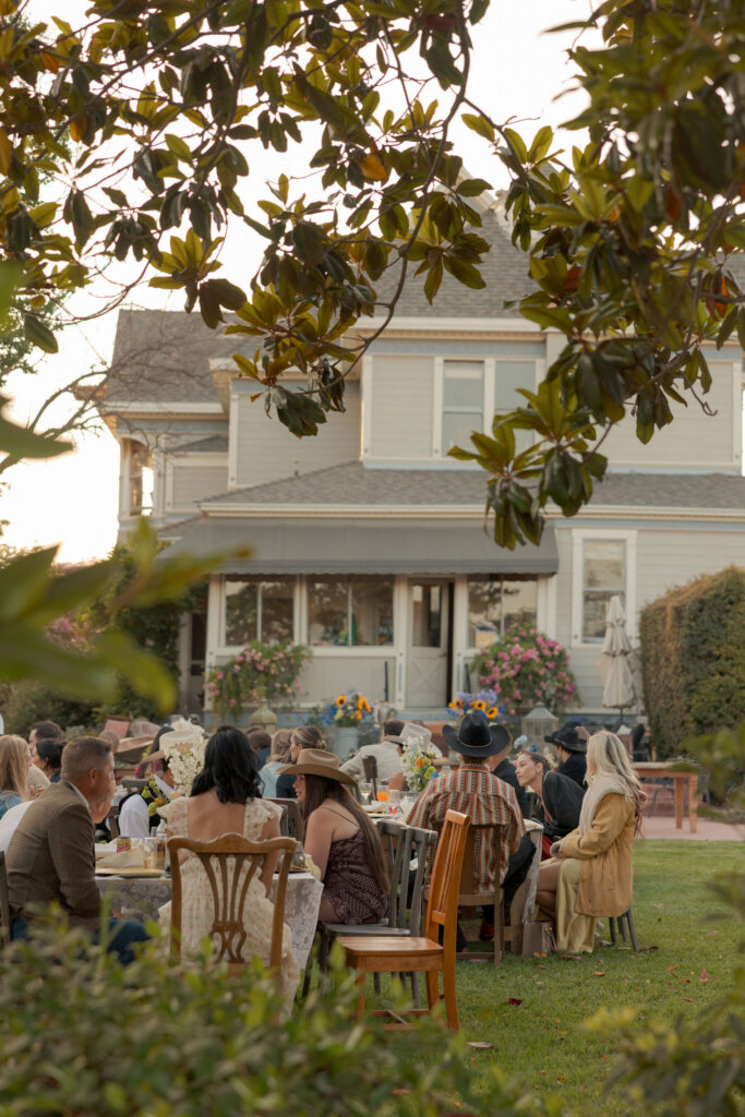 Wedding guests seated during the outdoor reception at Faulkner Farm in Santa Paula, California.
